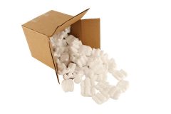 Isolated open cardboard box with spilled packing peanuts